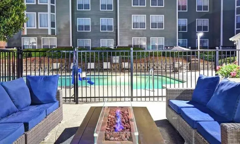 Comfortable outdoor lounge for relaxing and coworking around the pool at Homewood Suites by Hilton Atlanta-Galleria/Cumberland.