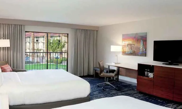Gorgeous queen room with natural light, TV, and work area at DoubleTree by Hilton Hotel Bakersfield.