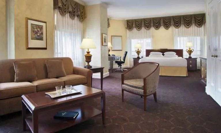 Spacious family room with king size bed and working station at The Drake.