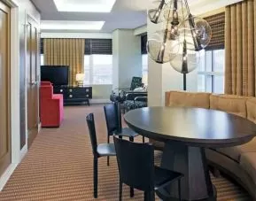 Living room with working station in a hotel suite at the Hilton Omaha.