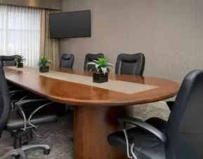 Meeting room with window and TV screen at the Hilton Garden Inn Dallas/Duncanville.