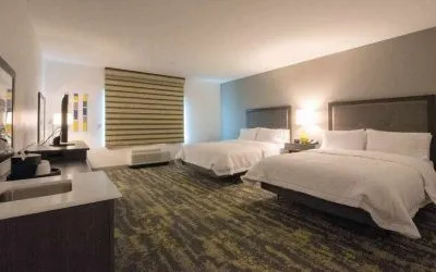 Double queen bedroom at the Hampton Inn & Suites by Hilton-Irvine/Orange County Airport.