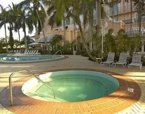 Outdoor patio with pools perfect as workspace at the Embassy Suites by Hilton Miami - International Airport.