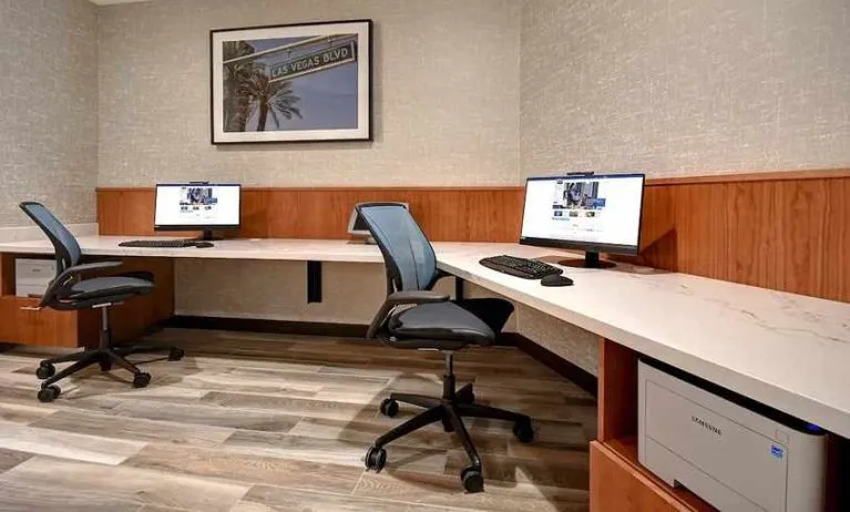 dedicated business center with PC, internet, printer, and work desk at Home2 Suites by Hilton Las Vegas Convention Center.