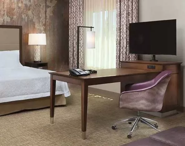 Spacious king suite with work area at Hampton Inn & Suites Murrieta Temecula.
