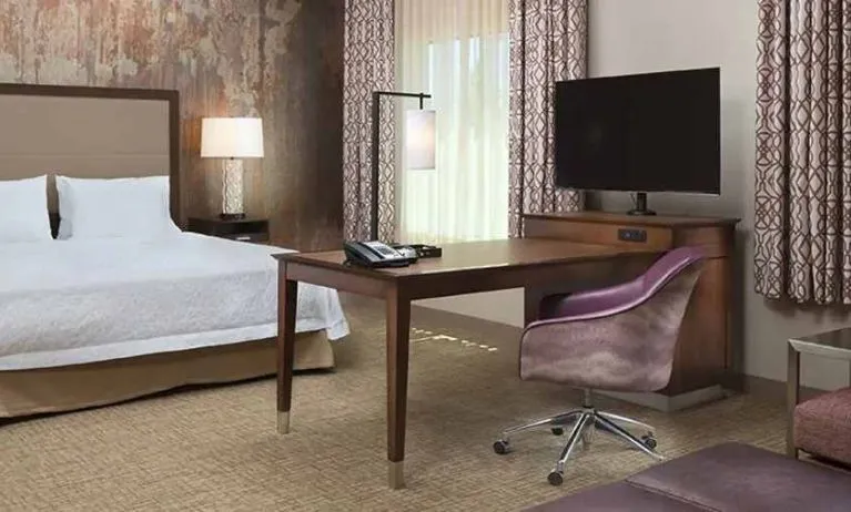 Spacious king suite with work area at Hampton Inn & Suites Murrieta Temecula.