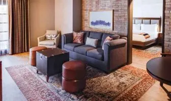 Stylish living room in a king suite at the Estancia del Norte San Antonio, Tapestry Collection.