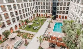 Beautiful outdoor space with pool and garden at the Estancia del Norte San Antonio, Tapestry Collection.