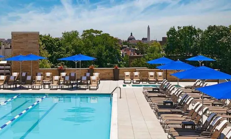 gorgeous outdoor pool with seating and sun beds at Washington Hilton.