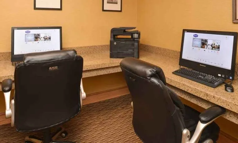 Dedicated business center with printer, computers, and internet at Hampton Inn & Suites Pueblo-Southgate.