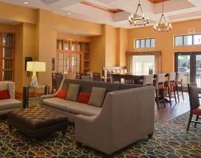 Comfortable lobby lounge area ideal for coworking at Hampton Inn & Suites Pueblo-Southgate.