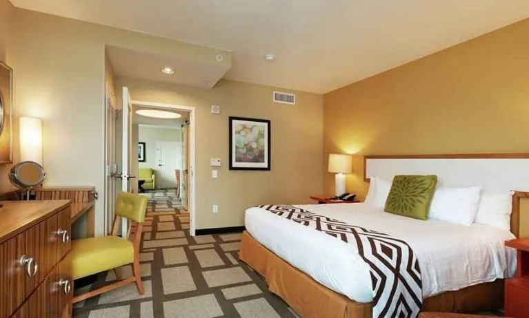 Beautiful delux king room with TV and work area at Embassy Suites by Hilton Houston Downtown.