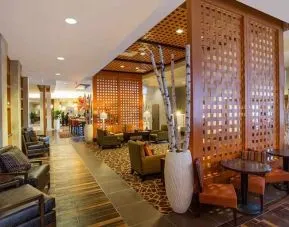 Comfortable lobby lounge area ideal for coworking at Hampton Inn Houston Downtown.