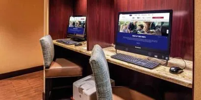 Working station with computers and printer at the Hampton Inn Albuquerque, University-Midtown (UNM).