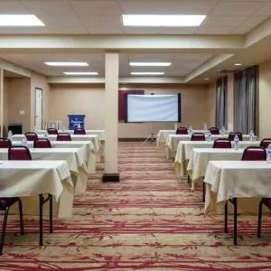 Large meeting room with tables and chairs at the Hampton Inn Albuquerque, University-Midtown (UNM).