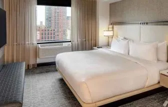 relaxing delux king room with TV at DoubleTree by Hilton Hotel & Suites Jersey City.