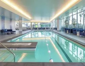 large indoor pool ideal for doing laps at Embassy Suites by Hilton Seattle Downtown Pioneer Square.