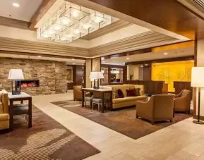 Elegant lobby workspace with sofas and fireplace at the DoubleTree by Hilton Pittsburgh Green Tree.