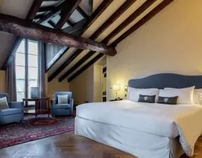 Bright and spacious king bedroom at the Grand Hotel Villa Torretta Milan Sesto, Curio Collection.