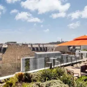 Beautiful outdoor terrace overlooking the city and the tour eiffel at the Canopy by Hilton Paris Trocadero.