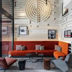 Comfortable hotel workspace with sofas at the Canopy by Hilton Paris Trocadero.