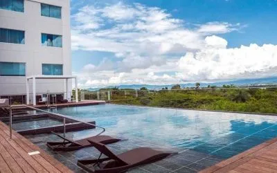 gorgeous outdoor pool with sun beds at Hilton Garden Inn Santa Ana San Jose.