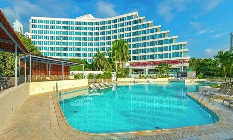 beautiful outdoor pool with sun beds at Hilton Cartagena Hotel.