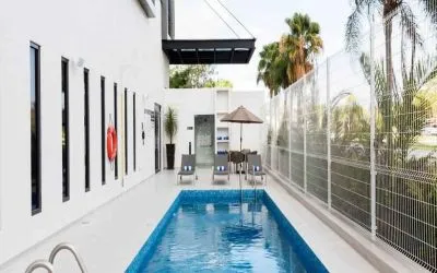 Relaxing outdoor pool at the Hampton Inn by Hilton Cancun Cumbres.
