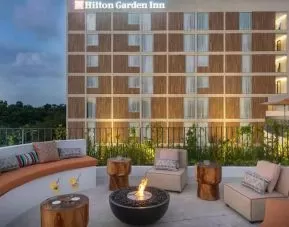 Terrace with firepit suitable for co-working at the Hilton Garden Inn Cancun Airport.
