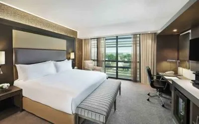King bedroom with desk at the Legend Hotel Lagos Airport, Curio Collection by Hilton.