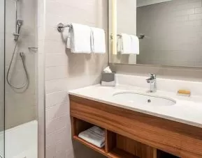 clean and spacious bathroom with shower at Hilton Garden Inn Bucharest Old Town.