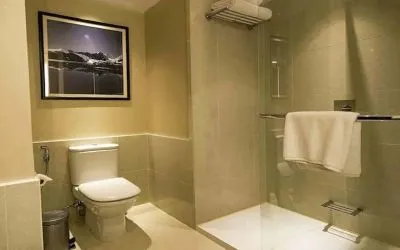 clean and spacious guest bathroom with shower at Hilton Garden Inn Trivandrum.