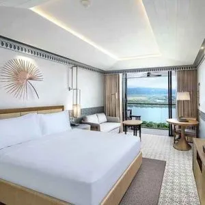 lovely delux king with TV, work desk, and couch at DoubleTree by Hilton Goa - Panaji.