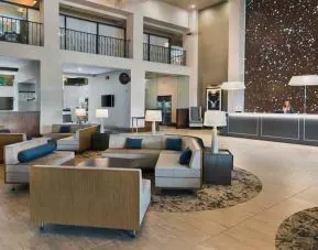 Lobby workspace with sofas at the Embassy Suites by Hilton Los Angeles Downey.