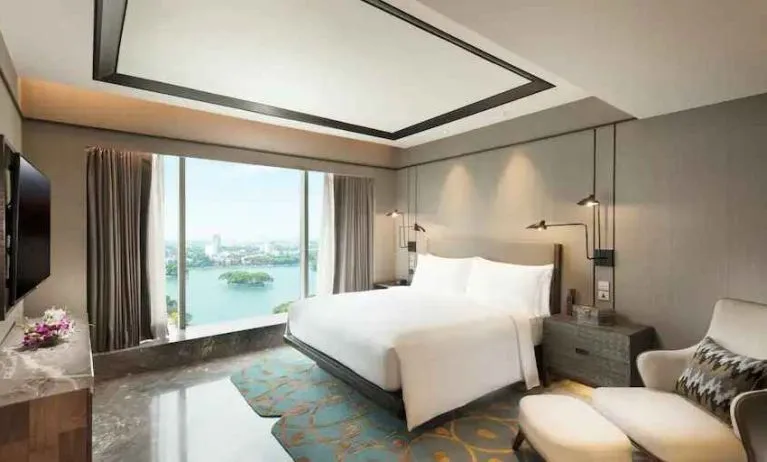 Comfortable king bedroom at the Conrad Bengaluru.