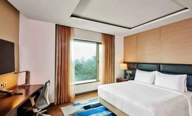 King bedroom with desk at the Hilton Garden Inn Lucknow.