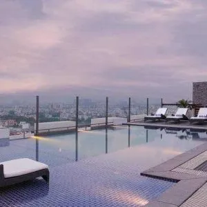 Relaxing outdoor pool at the DoubleTree by Hilton Gurugram Baani Square.