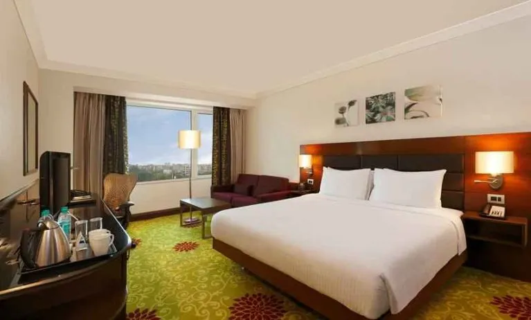 King bedroom with desk at the Hilton Garden Inn New Delhi/Saket.