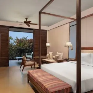 King bedroom with desk at the Hilton Goa Resort.
