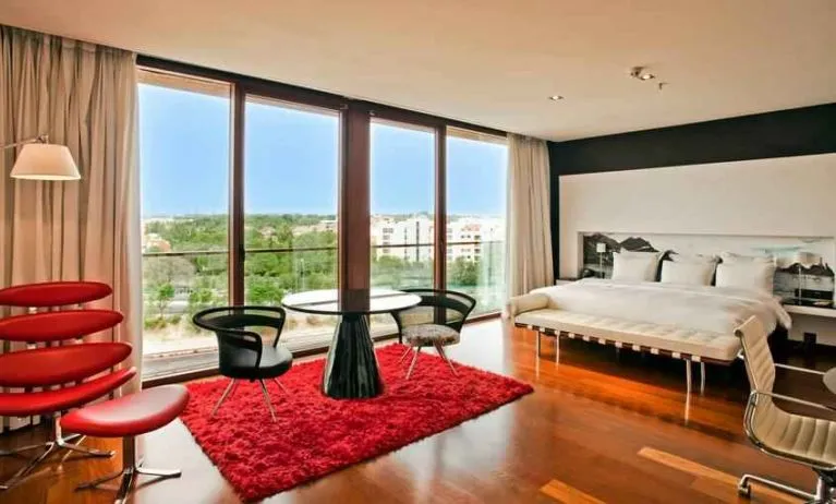 King suite with working station at the Hilton Madrid Airport.