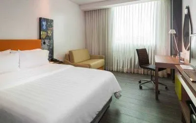 King bedroom with desk at the Hampton by Hilton Cartagena.