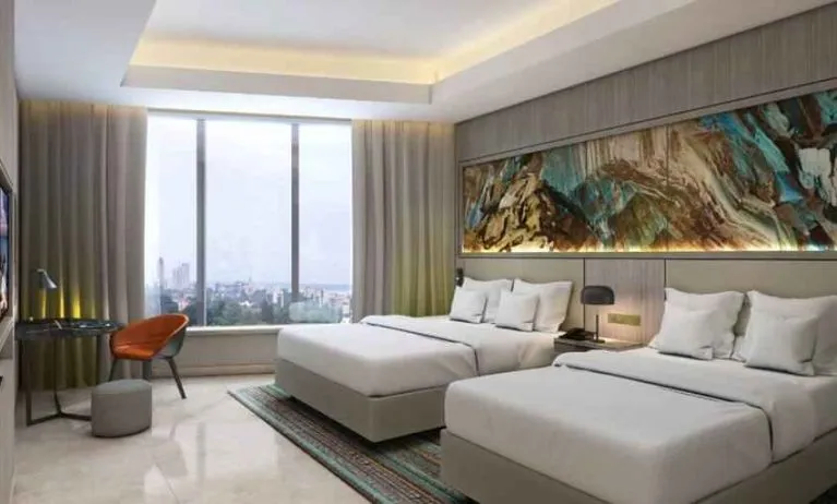 Twin room with desk at the Hilton Kinshasa.