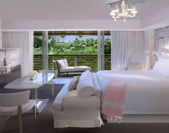 Hotel suite with working station and balcony at SLS South Beach.