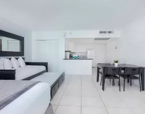 Hotel room with sofa and table at New Point Miami.