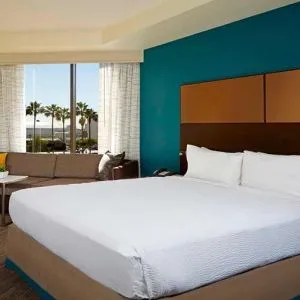 King bedroom with workstation at Residence Inn By Marriott LAX Airport.