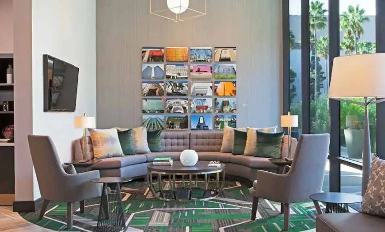 Lobby and coworking lounge at H Hotel Los Angeles, Curio Collection By Hilton.
