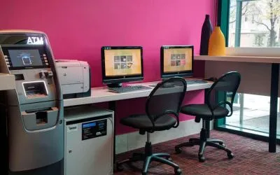 Well equipped business center with PC, internet, and printer at Courtyard By Marriott New York JFK Airport.
