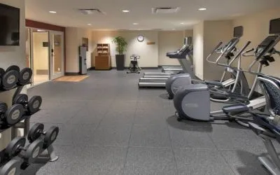 The hotel fitness center, with racks of weights and assorted exercise machinery.