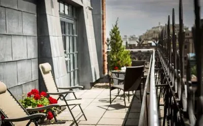 Many of the rooms in Hotel Gault have balconies with chairs and tables.