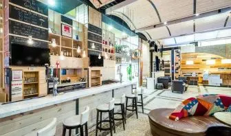The Gastro Bar of TRYP By Wyndham Times Square South, with both bar stools and soft seats.